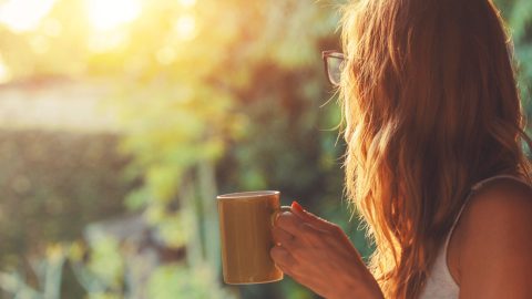 Woman holding a cup of coffee