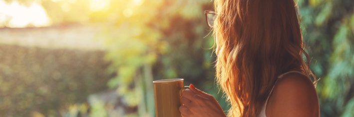 Woman holding a cup of coffee