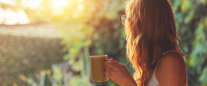 Woman holding a cup of coffee